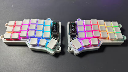 Corne Choc RGB wireless low profile split keyboard — white case with white blank keycaps, per-key RGB lighting and dual OLED screens, top-down view
