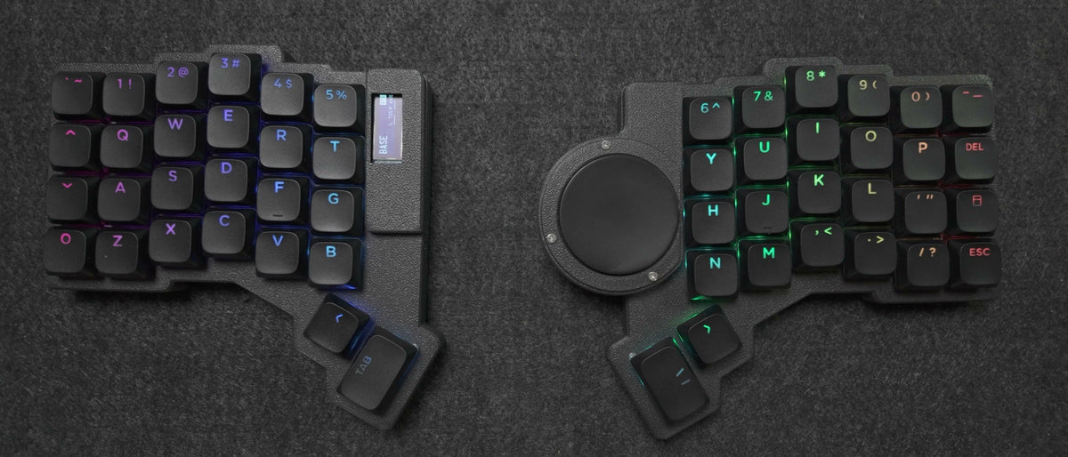 Parix 52 split keyboard, both halves top-down, black shine-through keycaps with per-key RGB, OLED on the left half, trackpad on the right