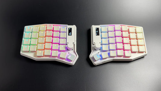 Per-key RGB cycling across the white Sofle Choc split keyboard's translucent keycap legends
