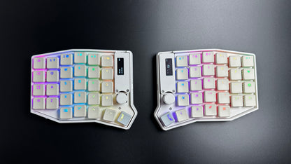 Sofle Choc 58-key split keyboard in white with Chosfox CFX WoB translucent keycaps lit by per-key RGB — top-down view